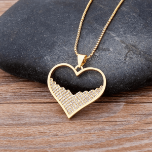 Goldtone Heart Pendant Necklace With Half Cubic Zirconia In Clear